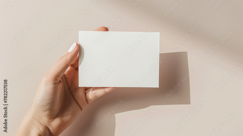 Obraz premium Create an image of a hand model holding a 5 x 7 inch card, mockup style.