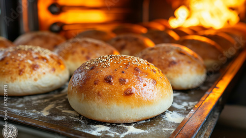 Bread on a conveyor belt in a bread factory. © Janis Smits