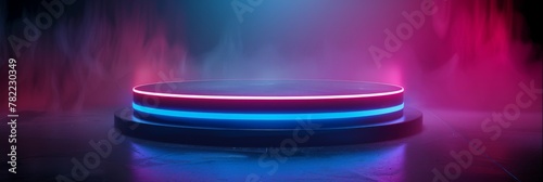 Vivid neon pink and blue lit round podium in haze - This image captures a round podium bathed in contrasting neon pink and blue lights, enveloped by a dramatic haze photo
