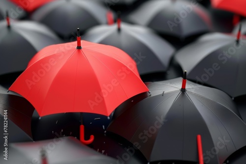 Unique red umbrella among black umbrellas representing business leadership 3D illustration photo