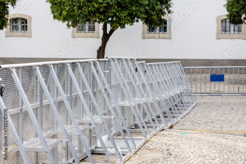 Metal barriers between the stage and the fans
