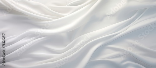 Flowing white fabric with abundant folds photo