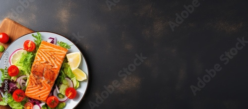 Salmon and vegetables on wooden board © HN Works