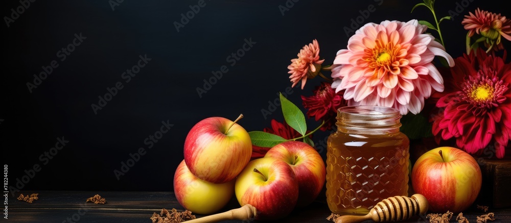 Fototapeta premium Apples, flowers, and honey in jar with dipper