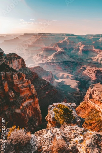 Sky meets water at the horizon, revealing the grand canyon from atop a mountain