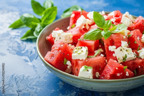 Watermelon salad with feta on blue rustic background