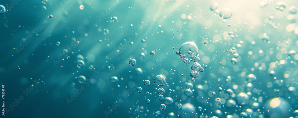 Underwater view with sunbeams and bubbles