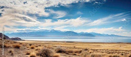 Vast lake and distant mountains at Antelope Island State Park photo