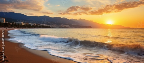 Beautiful sunset over sandy beach waves