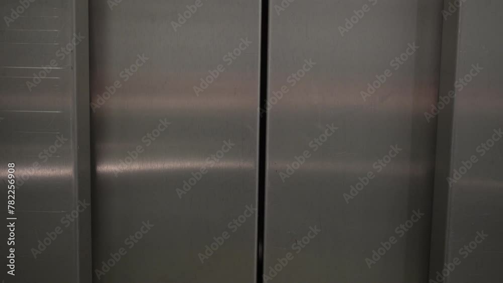 Elevator gracefully ascends, transporting viewers to new heights. The doors gently slide open, revealing an interior of a building. Elevator gracefully ascends, transporting viewers to new heights. The doors gently slide open, revealing an interior of a building.