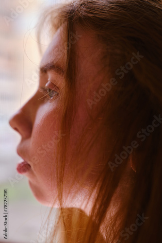 teenage girl facial close up side portrait Pretty young ginger model woman clean face with fresh clean spotted skin looking away thinking Natural beauty, skincare, cosmetology concept red hairs