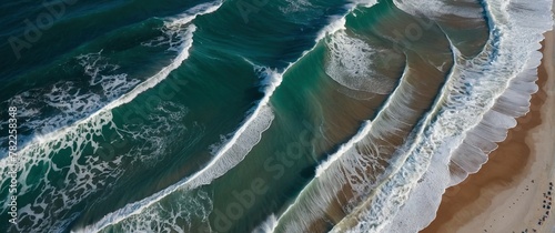 Scenic aerial view of a beach with blue ocean waves crashing on it. Beautiful seascape shot. Atmospheric sea coastal photography header wallpaper illustration concept.