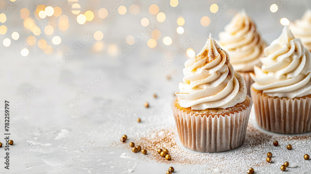 Vanilla cupcakes sparkling bokeh lights, holiday dessert concept, elegant sweet treat. Copy space
