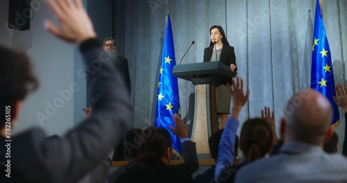 Bild auf Leinwand Female politician comes to tribune, delivers campaign speech, answers journalists questions, gives interview to media