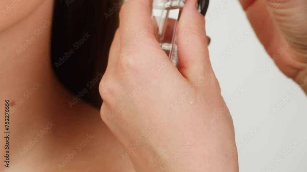 Young woman applying aroma oil or cream on her body shin close up. Skin care, beauty cosmetic treatment, morning routine, beauty products