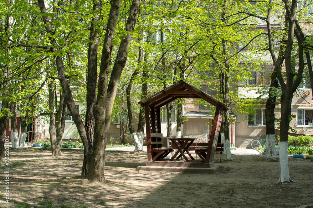 Wooden gazebo under the trees