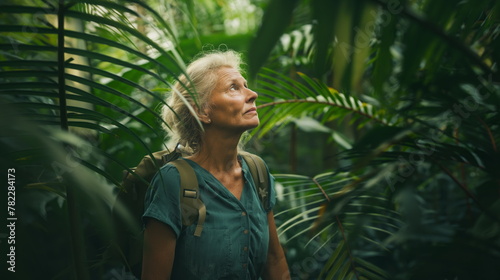 Woman in her 50s middle of a jungle on holidays travel and having fun and looking around