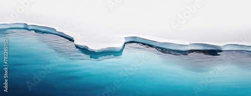 An abstract view of an icy glacier edge mid-melt, contrasting with the deep blue of the ocean, signifying climate change. World Environment Day. © Igor Tichonow