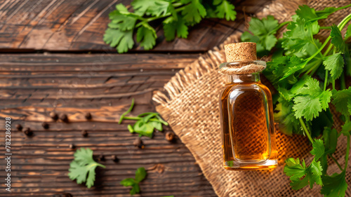 coriander essential oil in a bottle. Selective focus.