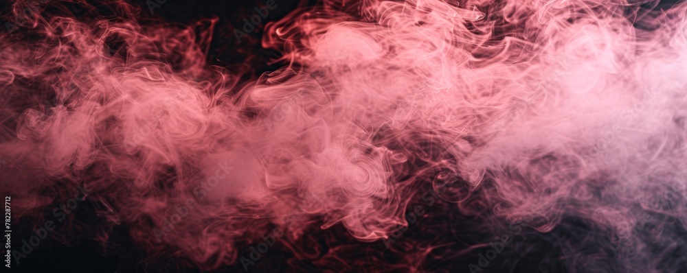 Wispy pink smoke on a dark background