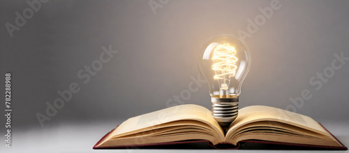 Opening book with light bulb. Concept of discovering new ideas, innovation, and educationIncandescent lamp burning above an open book, concept of an idea. generative AI