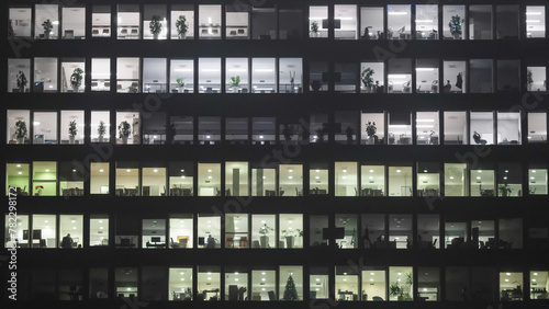 Night business building offices with employees working late