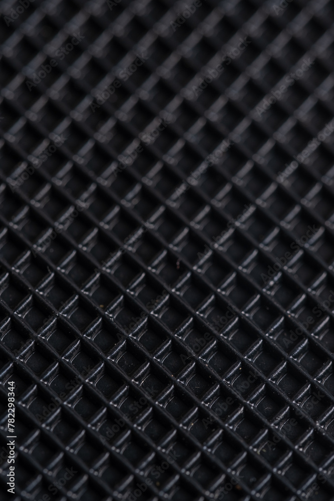 Close up of a black carbon fiber as a background. Macro.