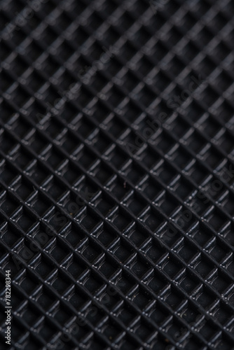 Close up of a black carbon fiber as a background. Macro.