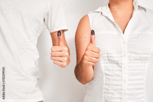 Couple with inked thumb, after voting.