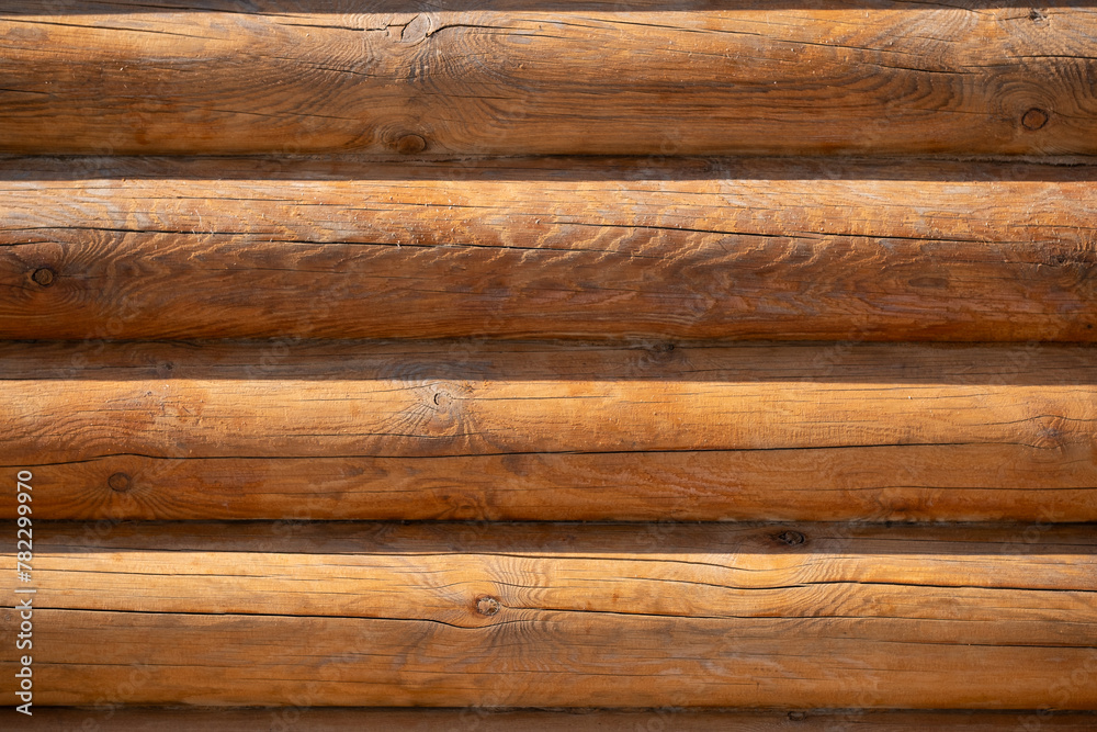 Wooden log house wall texture background, closeup view. Wooden log house wall texture background, closeup view.
