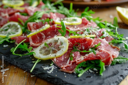 Beef carpaccio with arugula Parmesan vinaigrette and lemon Traditional Italian dish