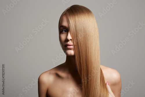 beautiful blond hair young woman. girl with smooth wheat colored hair