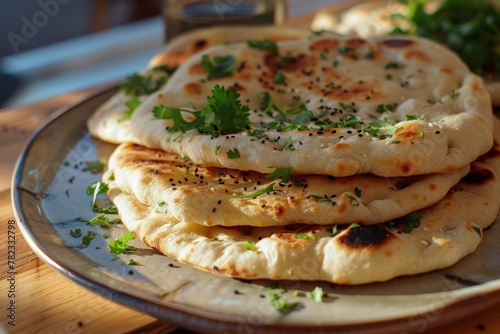 Just made homemade Naan bread with cilantro on a plate