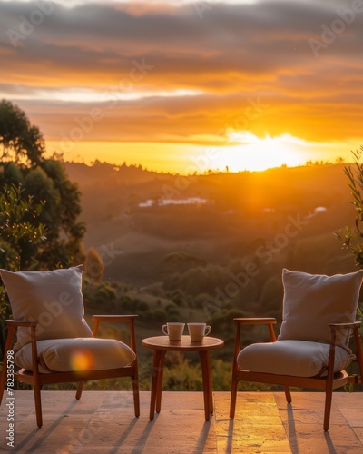 Serene Sunset Retreat: Two Chairs Overlooking Scenic Landscape at Dusk © Ryzhkov