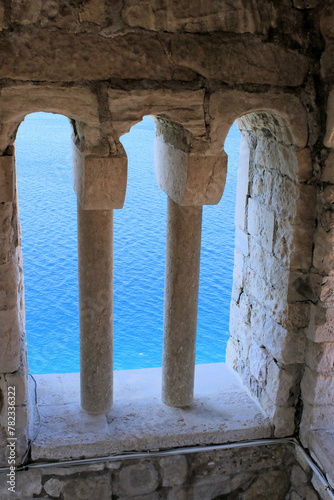 view on the blue sea  taken from inside a belltower  old town Rab  island Rab  Croatia