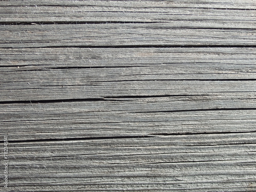 Texture of an old weathered cracked wooden board. Natural Background.