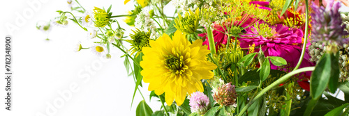 Summer bouquet of colorful Zinnia, onion inflorescences and mint sprigs, Rudbeckia Goldquelle and red clover, Ranunculus and Matricaria, home decoration with flowers banner photo