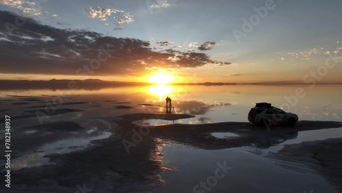Salar de Uyuni in Bolivia during sunset. Aerial image taken with a drone. Uyuni Salt Flats. Altiplano, Bolivia. Rainy Season. Tunupa Volcano. Clouds Reflection on Water in Lake Surface