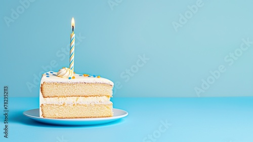 birthday piece of cake with a lit candle and a clean pastel blue background, copy space on the right