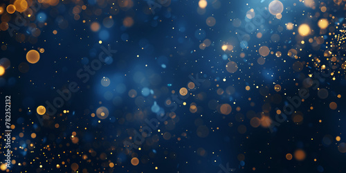 Festive golden glitter and sparkles on dark background 