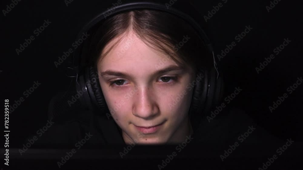 Kid Playing on Laptop, Computer in Night, Headphones Child Browsing Internet on Desktop, Girl Plays Video Games on Device Evening Kid Playing on Laptop, Computer in Night, Headphones Child Browsing Internet on Desktop, Girl Plays Video Games on Device Evening