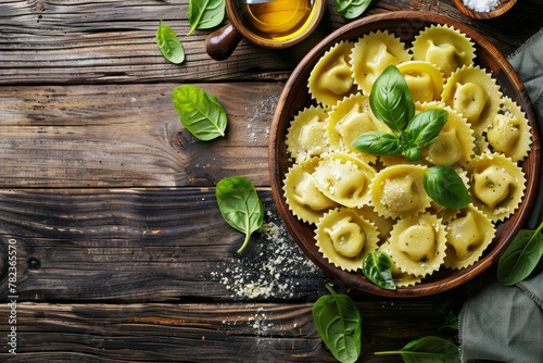 Spinach and ricotta stuffed ravioli on rustic wood background
