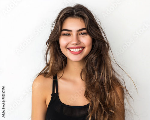 Pretty face of beautiful smiling woman posing at studio isolated on white wall beauty concept
