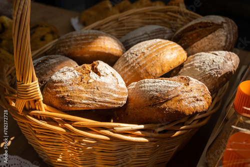 Basket of fresh bread. Freshly baked bread in different shapes. High quality photo