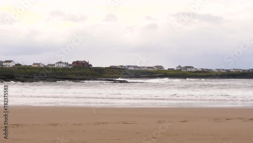 Choppy waves at the beach along the Atlantic Coast, on an overcast day. Bundoran, Co. Donegal, Ireland photo