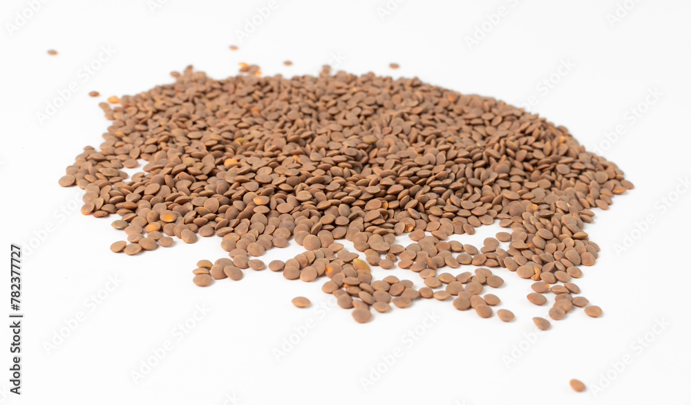 Lentils are piled on a white table Lentils are piled on a white table