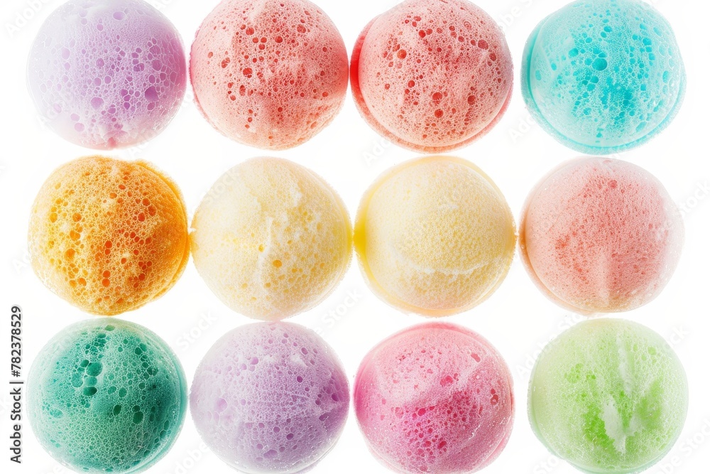 12 different colored bath puffs on white background with clipping paths 12 different colored bath puffs on white background with clipping paths