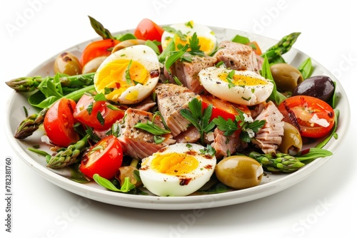 Grilled tuna eggs tomatoes olives asparagus salad Isolated with clipping path