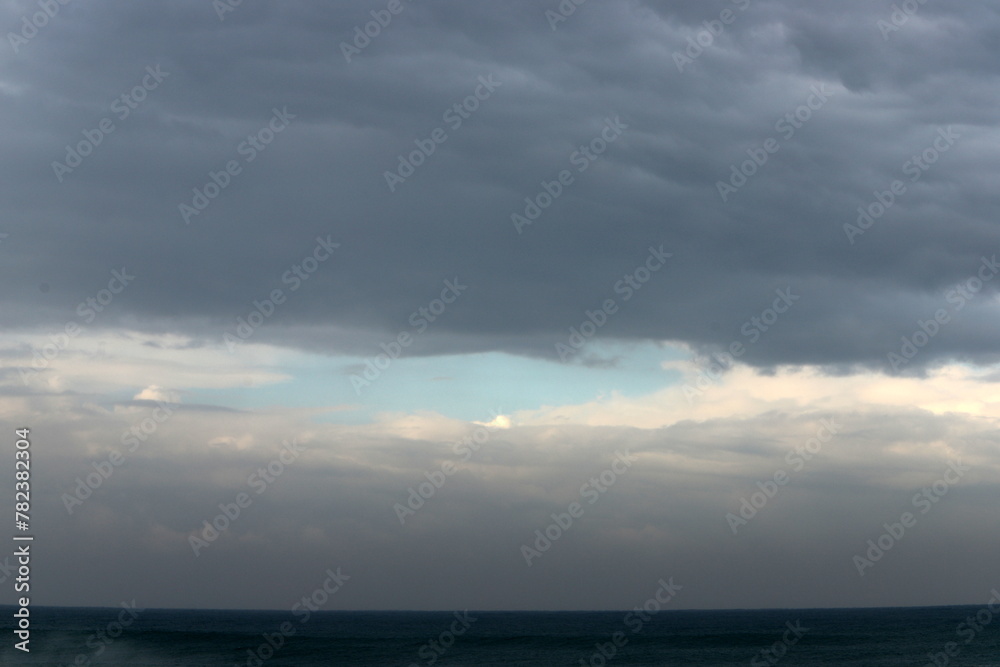Rain clouds in the sky over the Mediterranean Sea. Rain clouds in the sky over the Mediterranean Sea.