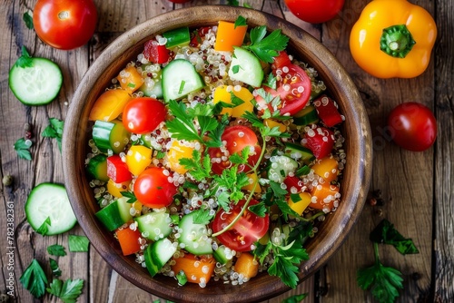 Healthy quinoa salad with fresh veggies on wooden background Superfood meal